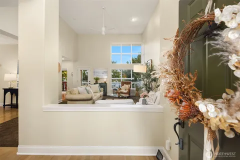 a view of living room with furniture and flowers