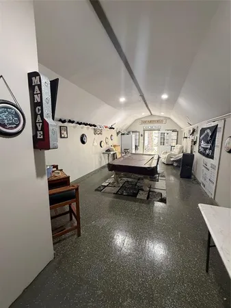 a living room with furniture and a mirror