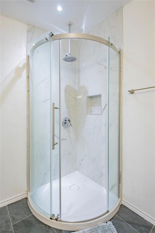 32894 County Road 2142 Kemp, TX 75143 - Photo 18 of 20 a bathroom with a glass shower door