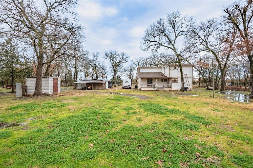 32894 County Road 2142 Kemp, TX 75143 - Photo 19 of 20 a house with huge green field in front of it