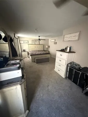 a bedroom with bed and window