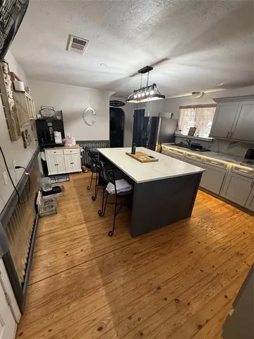 a bedroom with a bed and a table