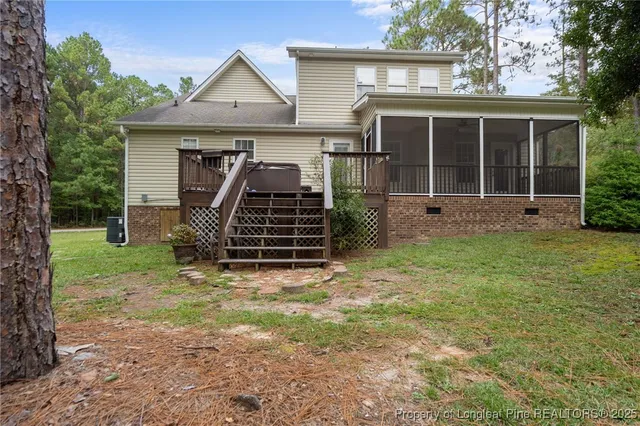 a view of a backyard with large trees