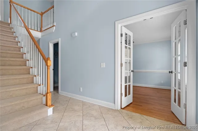 a view of an entryway with wooden floor