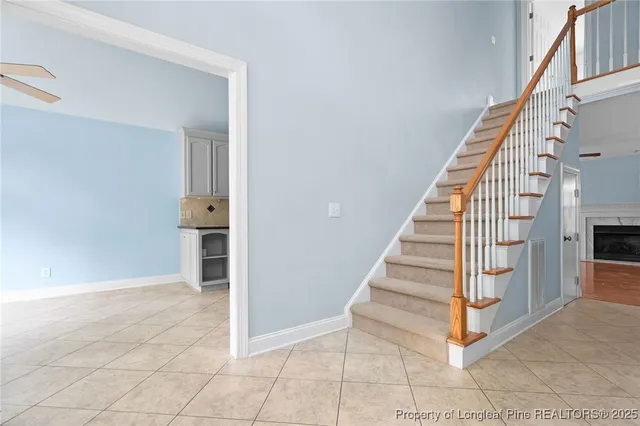 a view of entryway and hall with wooden floor