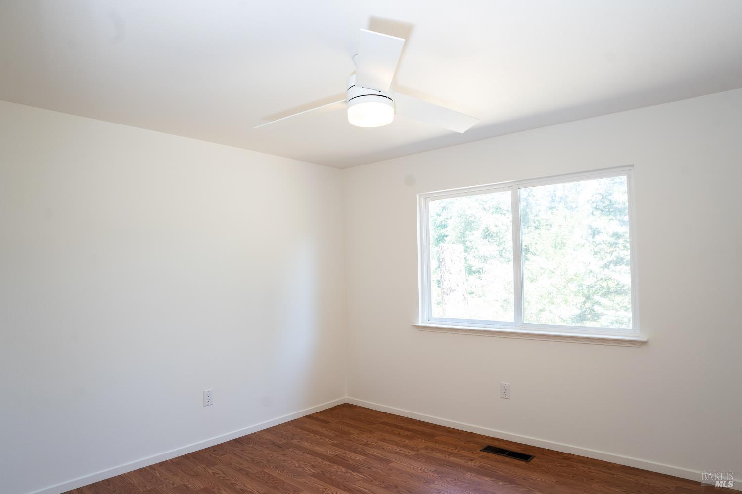 120 Cold Springs Road Angwin, CA 94508 - Photo 14 of 25 an empty room with wooden floor and windows