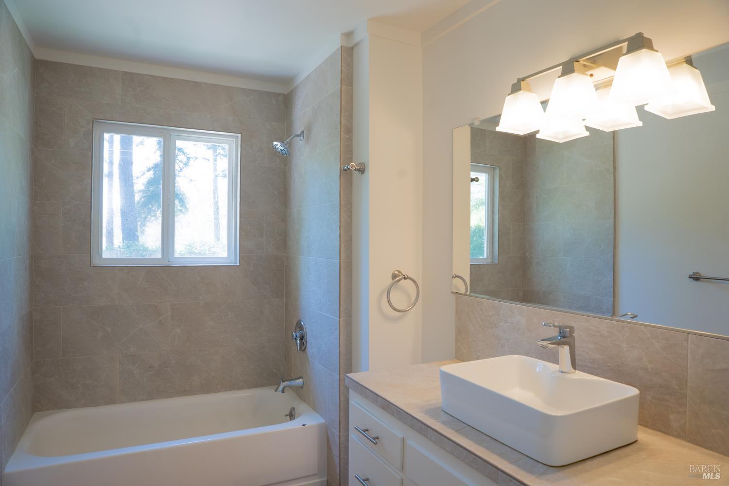 120 Cold Springs Road Angwin, CA 94508 - Photo 16 of 25 a bathroom with a bathtub a sink and a mirror