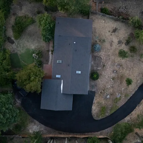 an aerial view of a house with outdoor space