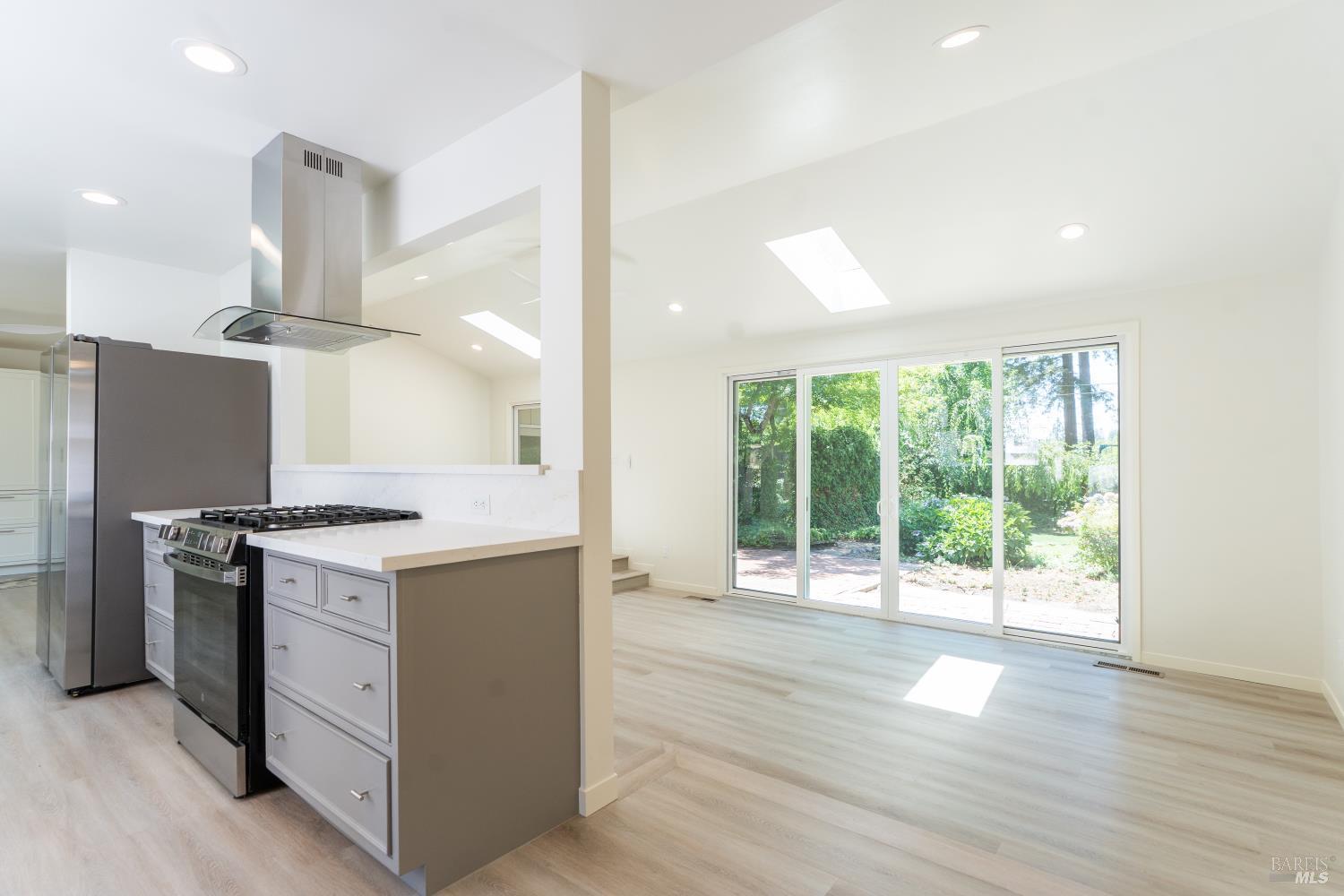 120 Cold Springs Road Angwin, CA 94508 - Photo 6 of 25 an open kitchen with a stove and wooden floor