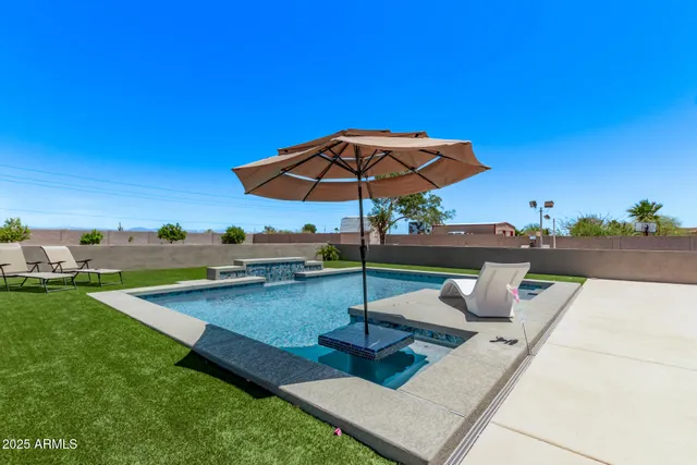 a view of a backyard with sitting area