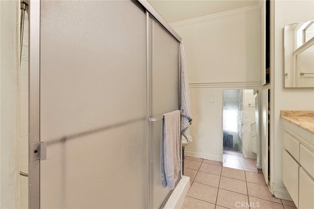 1087 Baseline Road La Verne, CA 91750 - Photo 25 of 39 a bathroom with a granite countertop shower and a sink