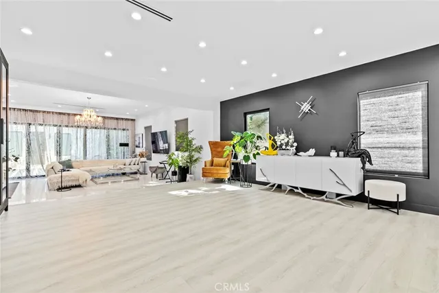 a kitchen with white cabinets and sink