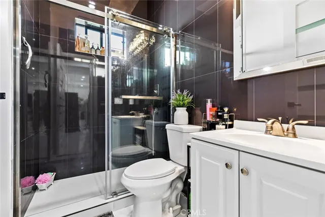 a view of a patio with a table chairs and wooden fence