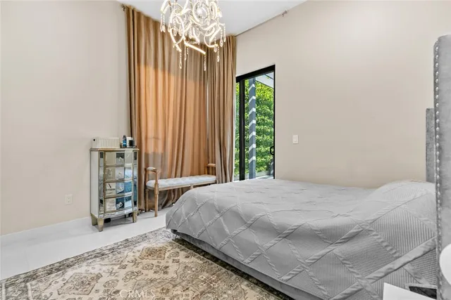 a view of a porch with furniture and a yard