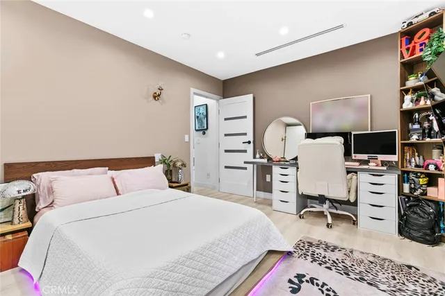 a kitchen with stainless steel appliances a refrigerator and a stove top oven
