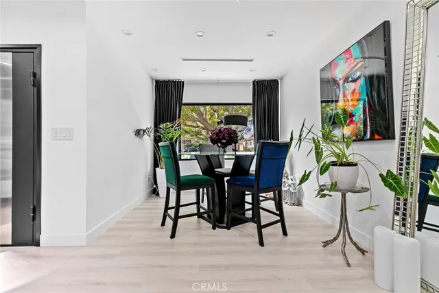 a kitchen with stainless steel appliances granite countertop a refrigerator sink and stove