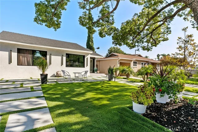 a view of a park with large trees