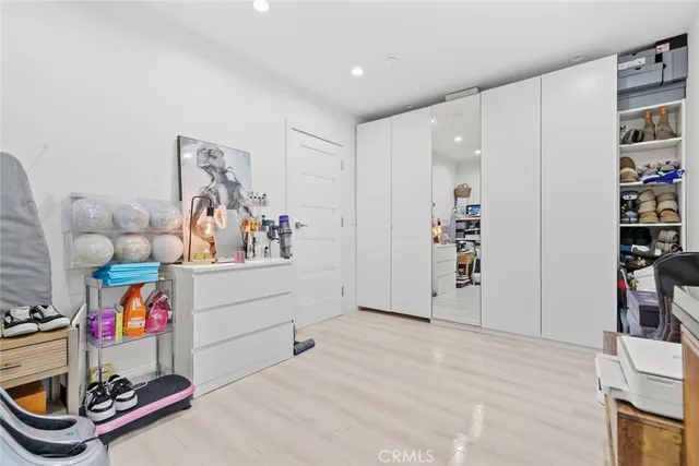 a living room with fireplace furniture and a potted plant
