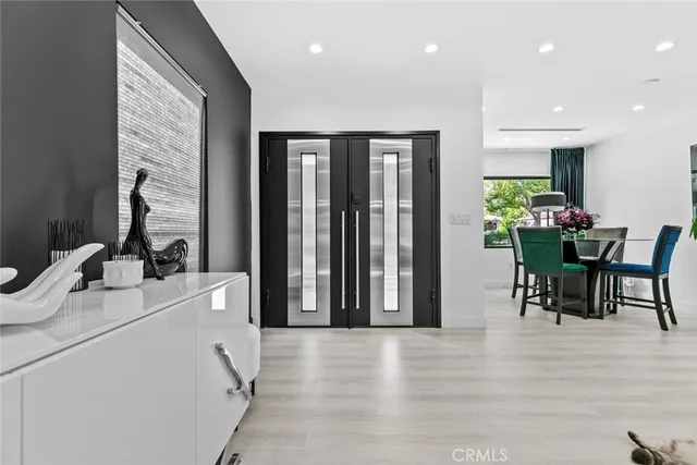 a living room with fireplace furniture and a chandelier