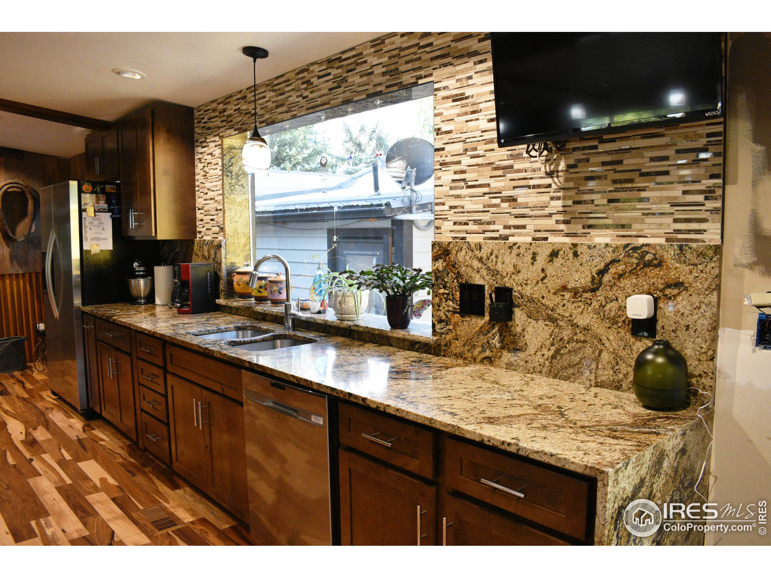 2801 Farview Drive Fort Collins, CO 80524 - Photo 13 of 40 a kitchen with a sink and cabinets