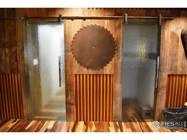 a bathroom with a double vanity sink mirror and shower