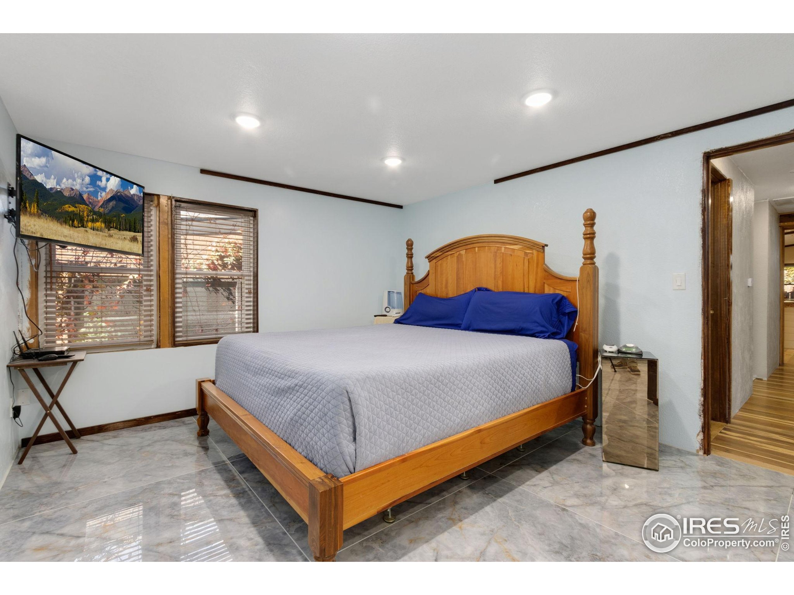 2801 Farview Drive Fort Collins, CO 80524 - Photo 16 of 40 a bed sitting in a room next to a window