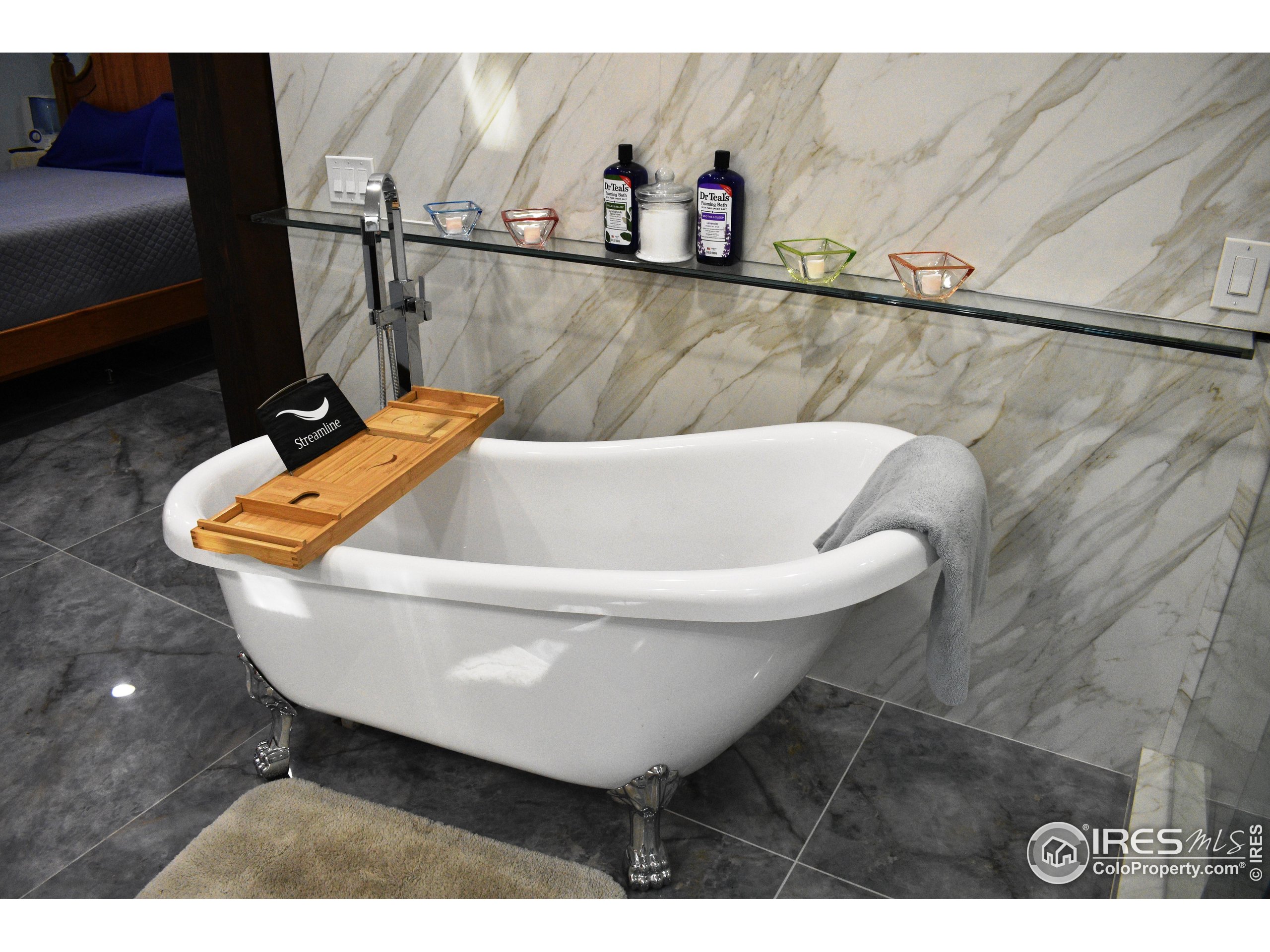 2801 Farview Drive Fort Collins, CO 80524 - Photo 20 of 40 a white bath tub sitting in a bathroom next to a sink