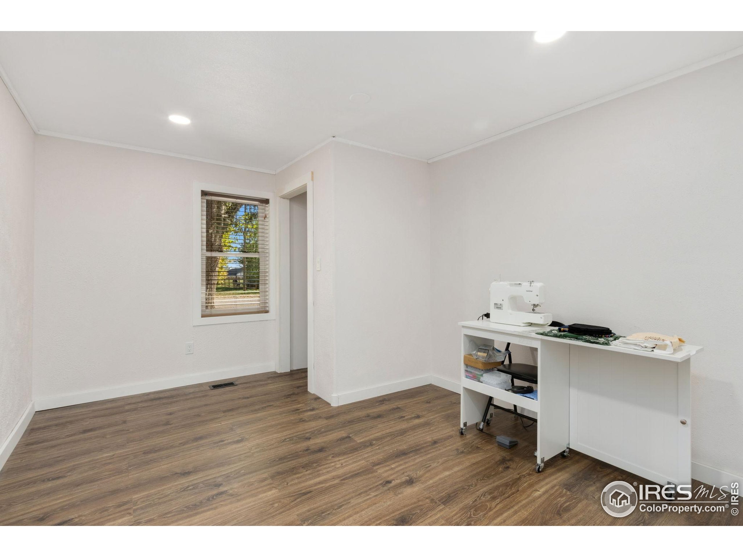 2801 Farview Drive Fort Collins, CO 80524 - Photo 23 of 40 a view of workspace with wooden floor