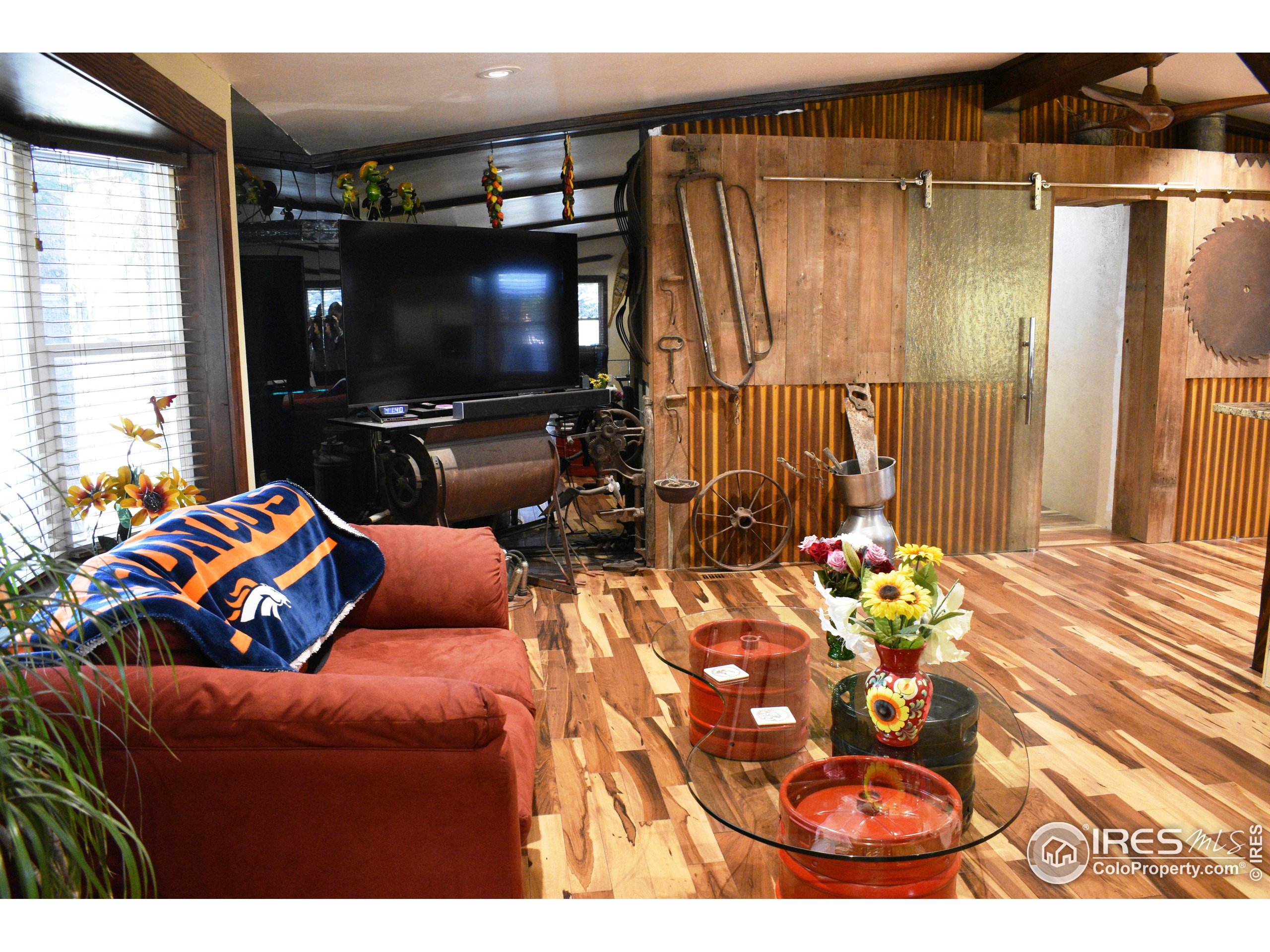 2801 Farview Drive Fort Collins, CO 80524 - Photo 7 of 40 a living room with furniture and a flat screen tv