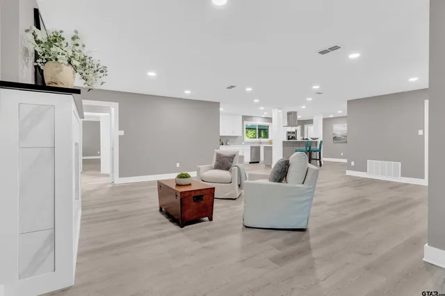 a living room with furniture and a table