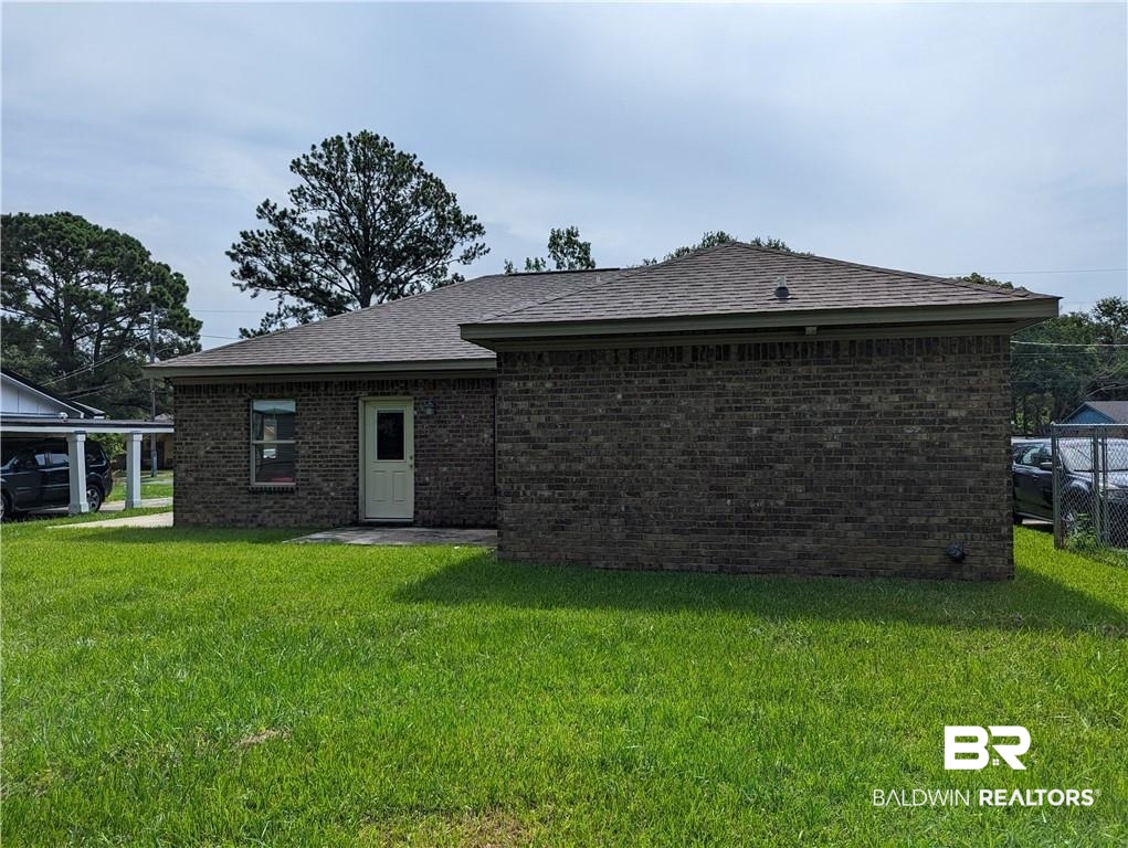 659 Bond Street Mobile, AL 36607 - Photo 10 of 10 Rear view of property with a yard