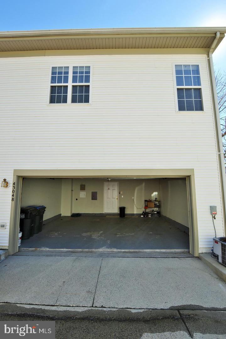 43048 Zander Terrace Ashburn, VA 20147 - Photo 17 of 18 a view of a car garage