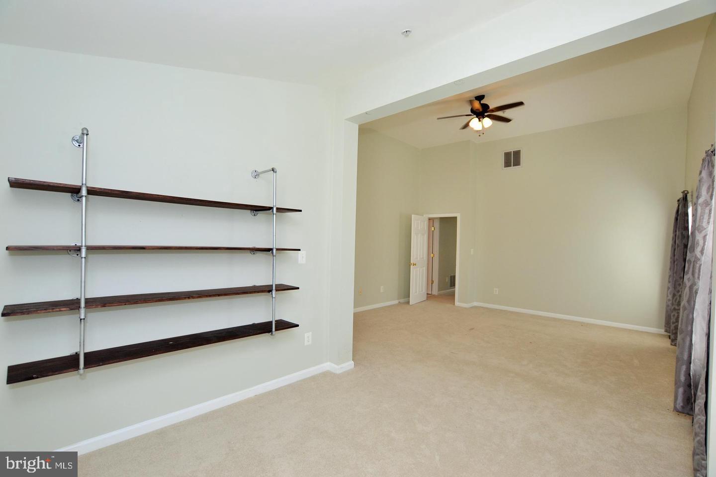 43048 Zander Terrace Ashburn, VA 20147 - Photo 9 of 18 a view of an empty room with a cabinet