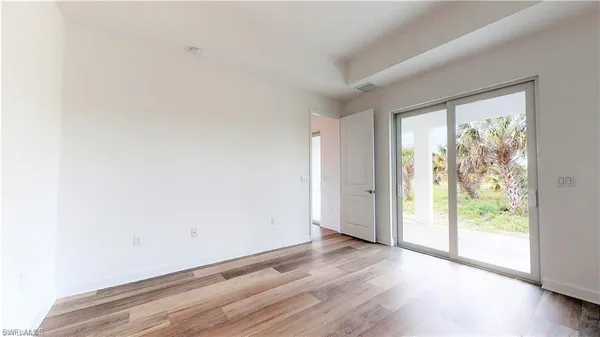 a kitchen with stainless steel appliances granite countertop a refrigerator a sink and a stove