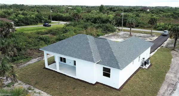 a aerial view of a house with pool