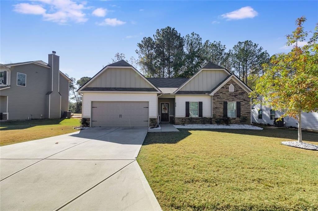 429 River Bluff Drive Temple, GA 30179 - Photo 1 of 1 a front view of house with yard and trees in the background