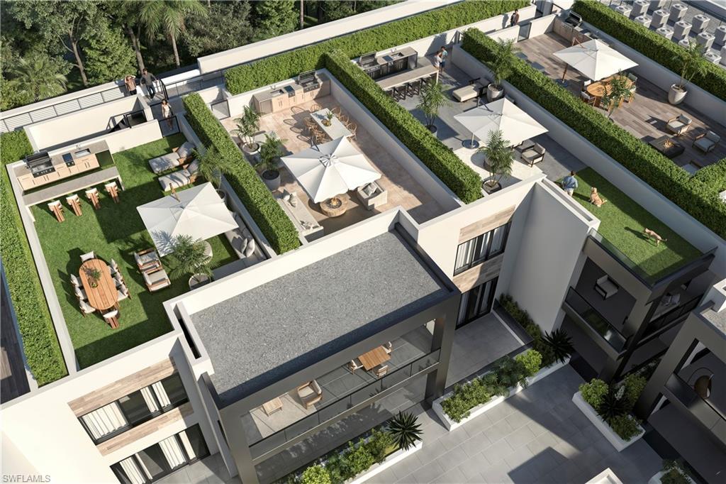 210 9th Street South, Unit 301 Naples, FL 34102 - Photo 2 of 7 an aerial view of a house with a garden