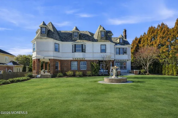 a view of a building with a yard