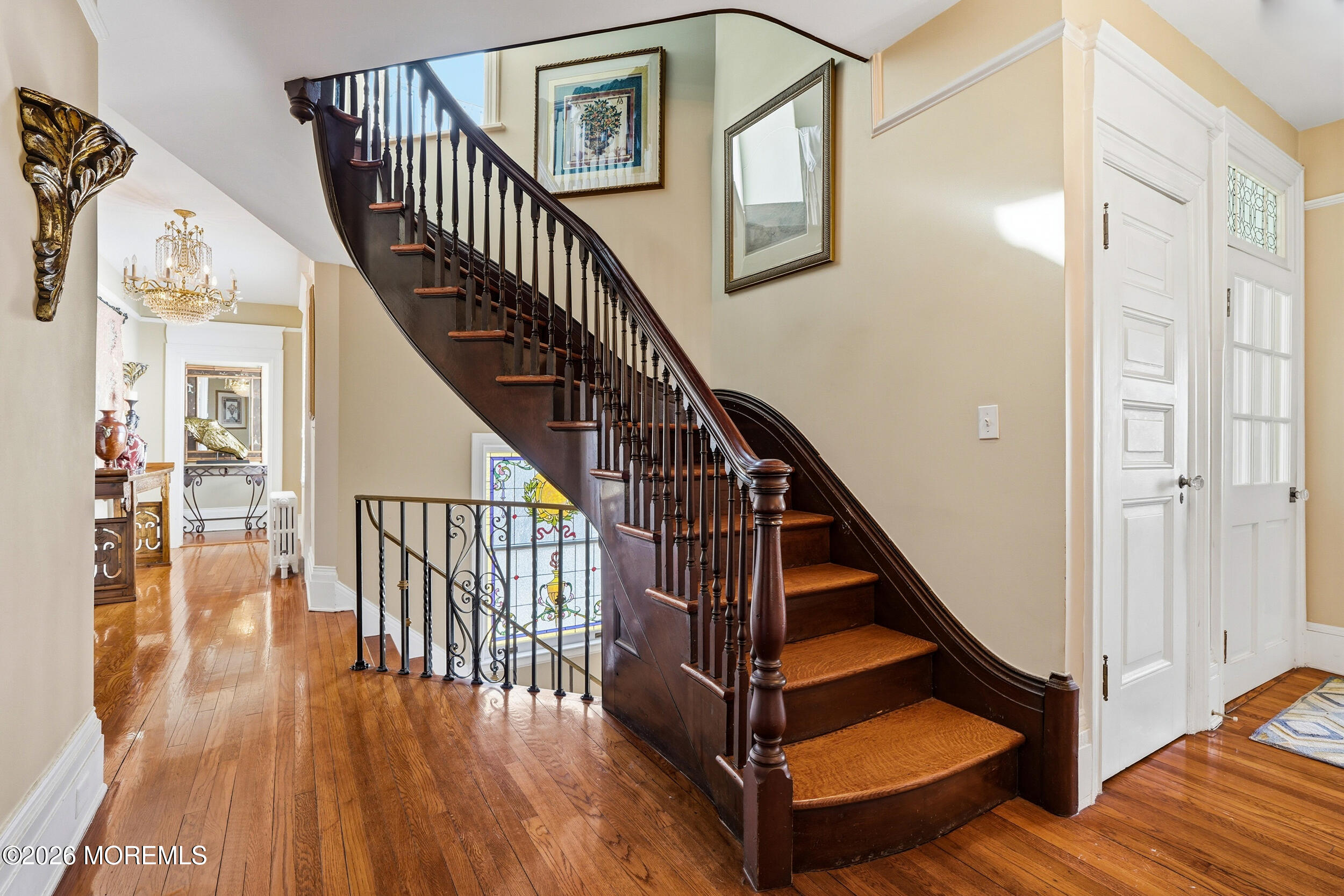 3 Elberon Square Long Branch, NJ 07740 - Photo 13 of 22 a view of staircase with wooden floor and a chandelier