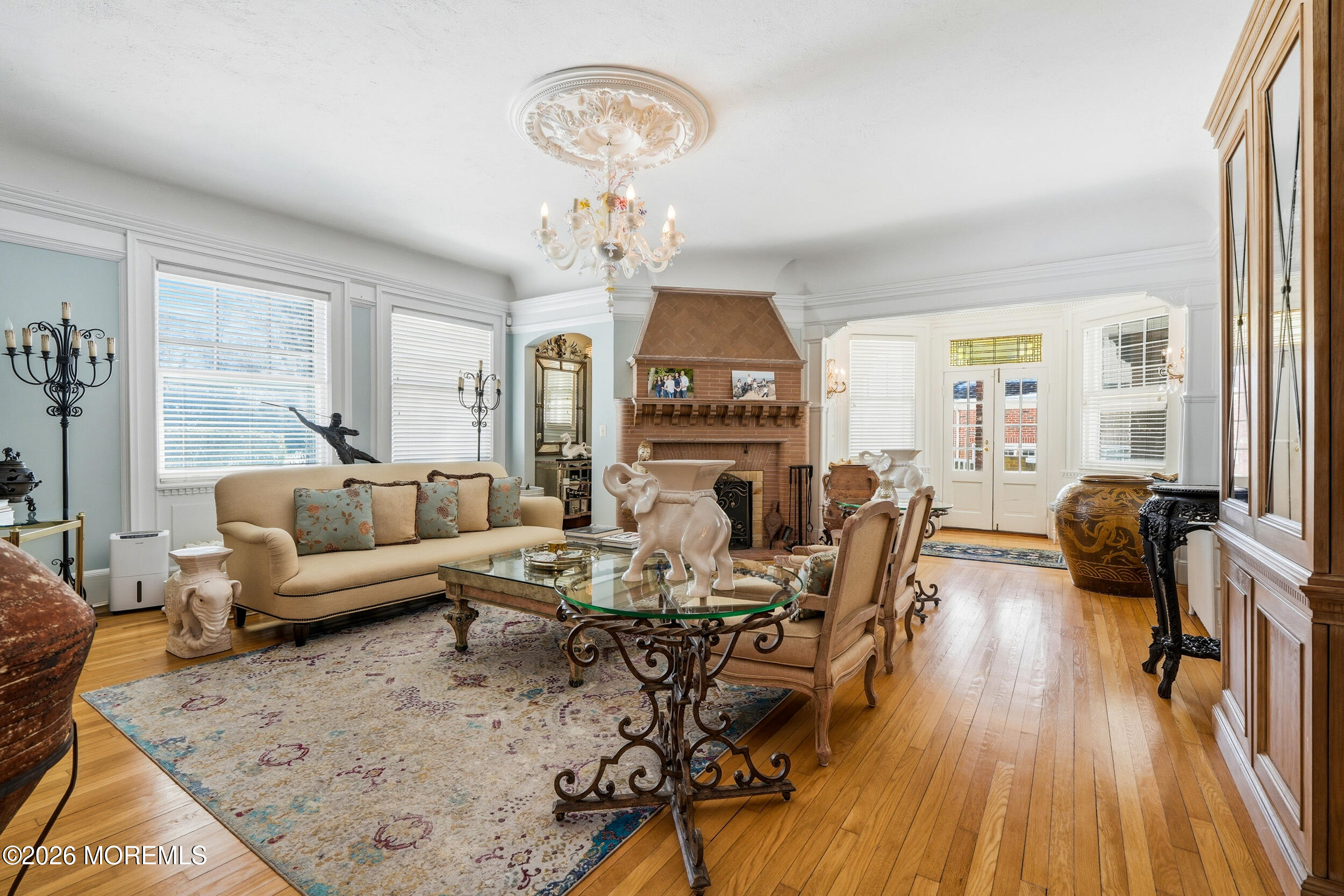 3 Elberon Square Long Branch, NJ 07740 - Photo 5 of 22 a living room with fireplace furniture and a wooden floor