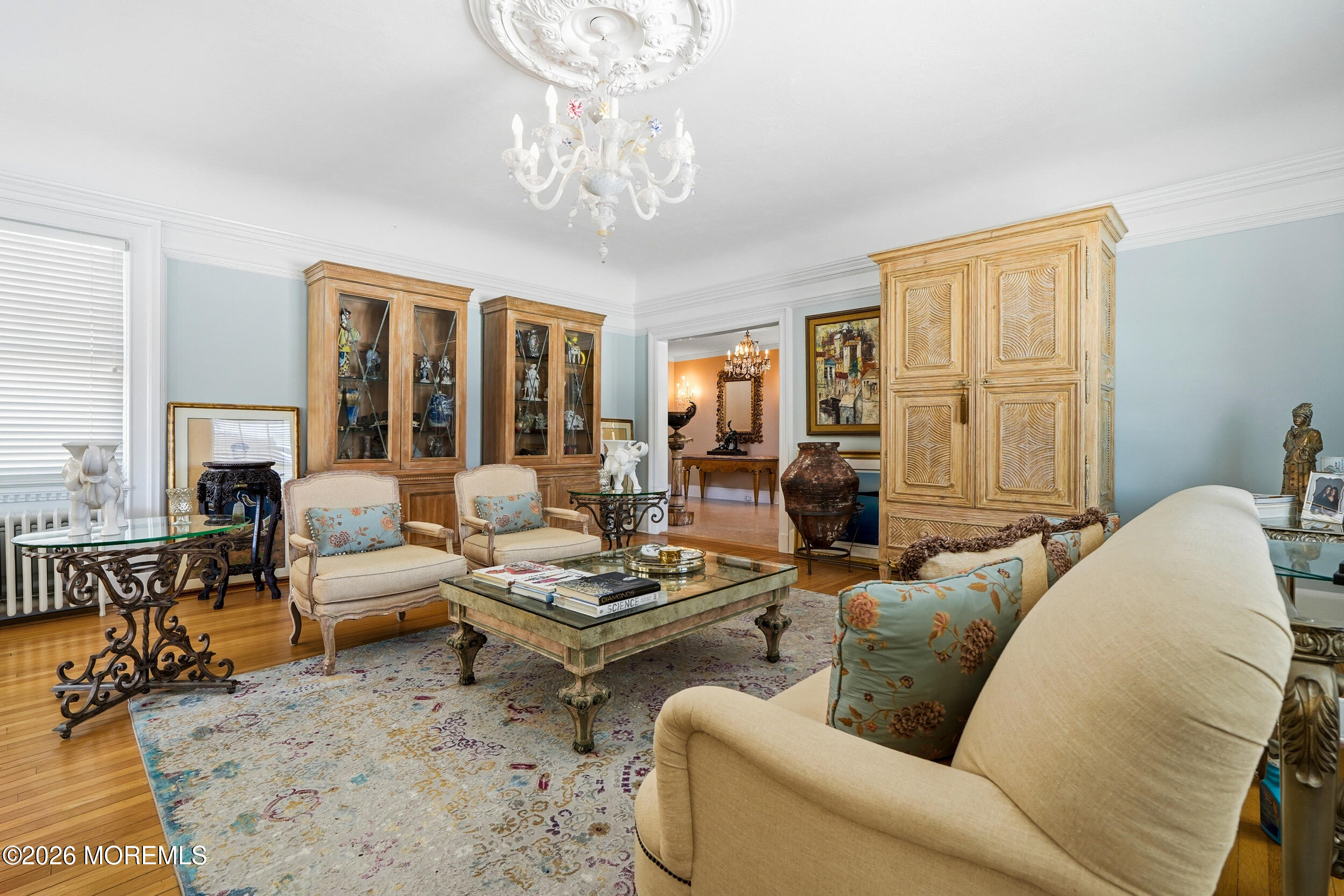 3 Elberon Square Long Branch, NJ 07740 - Photo 6 of 22 a living room with furniture chandelier and view of kitchen