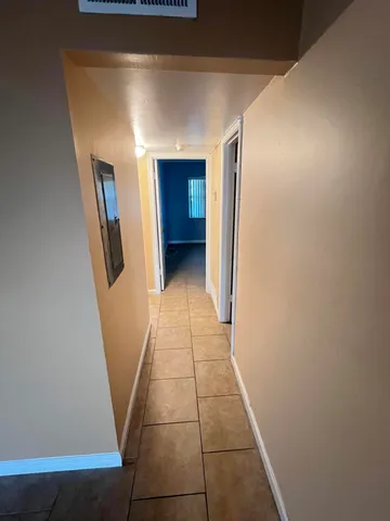 a view of hallway with stairs