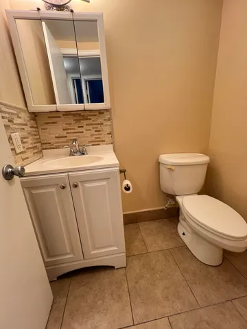 a bathroom with a toilet and a sink