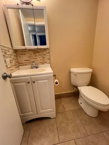 a bathroom with a toilet and a sink