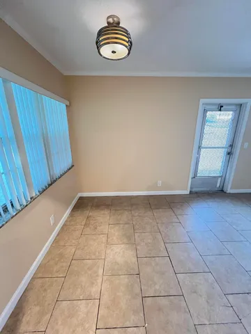 a view of a storage & utility room with a window