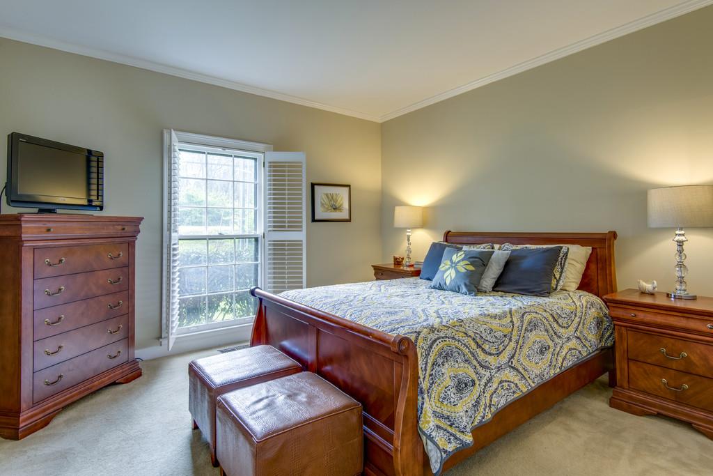 3600 Hobbs Road Nashville, TN 37215 - Photo 18 of 29 a bedroom with a bed and furniture