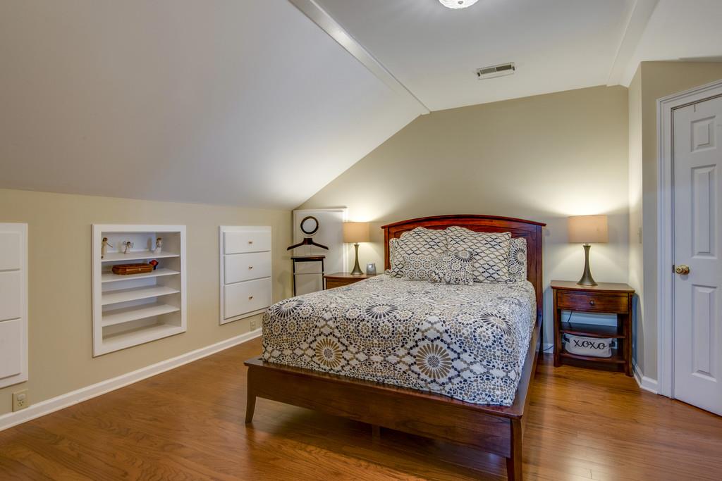 3600 Hobbs Road Nashville, TN 37215 - Photo 21 of 29 a bedroom with a bed a dresser and painting on the wall