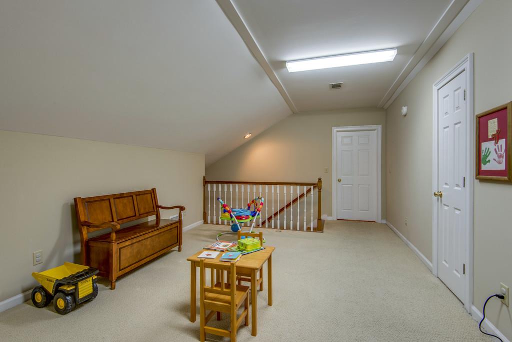 3600 Hobbs Road Nashville, TN 37215 - Photo 26 of 29 a hallway with a table and a couch