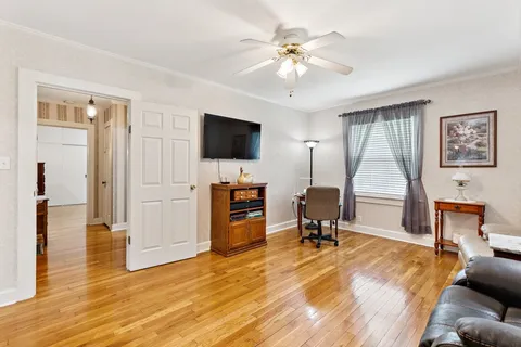 a view of a livingroom with furniture and a flat screen tv