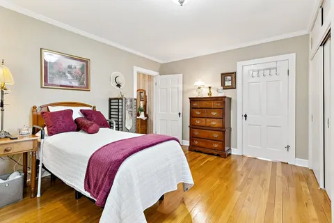 a bedroom with a bed and furniture